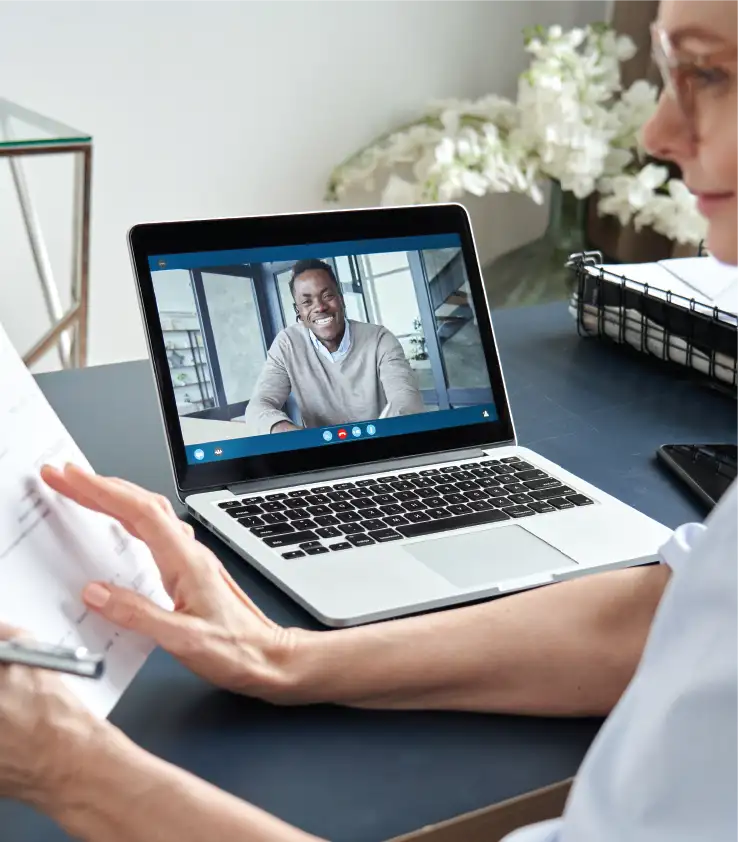 Interview happening on a computer via a platform similar to zoom