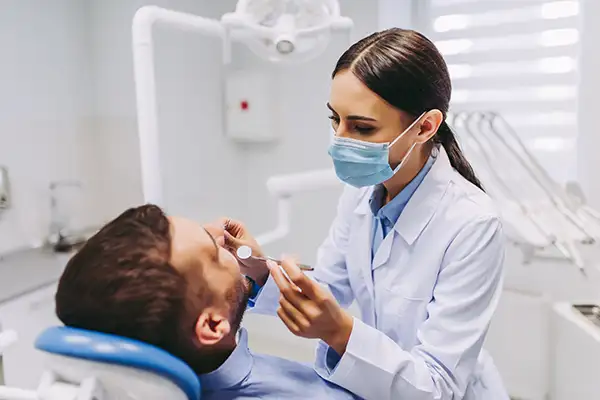 Dentist examining a patient's teeth